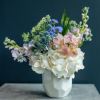 Pastel mixed bouquet in a white vase with white hydrangeas and pink alstroemeria
