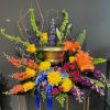 A colorful floral urn to commemorate the loss of a loved one.