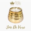 Gold candle in a rounded metallic holder with a white wick