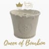 Cream ceramic candle jar with gold logo and text