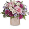 Pink roses and purple flowers in a glittery vase