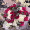 Bouquet of hot pink roses and white hydrangeas with eucalyptus