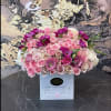 Large bouquet of pink and white roses in a white box