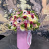 Large mixed bouquet in a pink cylindrical box with ribbon