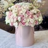 Pink and white rose bouquet in a pale pink hat box