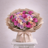 Bouquet of pink, lavender, and peach roses with magenta calla lilies