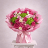 Pink and white rose bouquet with green hydrangeas in pink wrap
