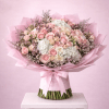 Pink and white rose bouquet wrapped in pink paper with a satin ribbon