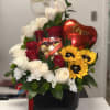 Bouquet of red and white roses with sunflowers and a heart balloon