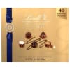 Box of assorted pralines with a blue ribbon and gold packaging