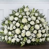 A grand fan-shaped sympathy arrangement in serene all-white blooms-perfect for memorial services
