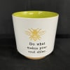 White ceramic pot with a bee graphic and inspirational text