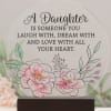 Decorative plaque with floral illustration and daughter quote on a wooden base