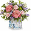 Pink roses and carnations in a painted glass cube vase