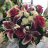 Bouquet of pink lilies and roses with white flowers