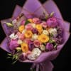 A lush, hand-tied bouquet of pastel roses and peonies designed to make