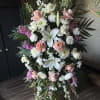 Large standing floral spray with white lilies, pink roses, and white chrysanthemums