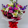 Classic romantic bouquet featuring purple roses and white lilies, accented with purple