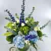 Ocean Mist features striking blue hybrid delphinium, blue and green hydrangea, crisp