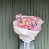 Pink and white bouquet with Hello Kitty toppers in a white wrap