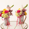 Mother&rsquo;s Day floral watering can featuring premium roses, hydrangeas, and seasonal blooms