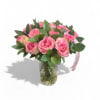 Pink roses arranged in a clear glass vase