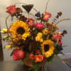 Falling all over this Pumpkin! Seasonal flowers and filler to fill up