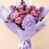 A luxurious hand-tied bouquet featuring premium roses, pastel purple hydrangeas, chrysanthemums, and