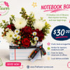 Notebook-shaped box with a mixed flower arrangement in red, white, and yellow