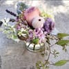 A gorgeous sentiment arrangement in a small 4 by 4" cylinder vase.