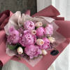This elegant bouquet features a stunning combination of soft pink peonies and