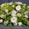A casket spray is the largest piece at a service and this