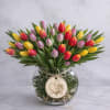 A vibrant, garden-inspired arrangement featuring a curated mix of premium tulips in