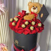 This elegant black box features 24 fresh red roses, beautifully arranged with