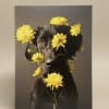 A playful portrait-style design featuring a black dog framed by bright yellow