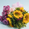 Bouquet of purple roses, pale pink roses, and yellow sunflowers