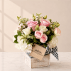 Soft, elegant, and effortlessly charming, this sweet floral arrangement features lush white