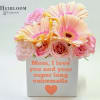 Pink and peach flowers in a white box with a Mother's Day message