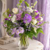 Soft lavender and creamy white blooms drift together in a garden-fresh composition