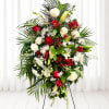 A dignified standing spray that speaks of respect and remembrance, this funeral