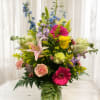 Bright, garden-fresh color greets them at first glance: an upright mixed bouquet