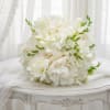 A lush, all-white bridal-style bouquet that reads timeless and serene-perfect as a