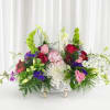 Large mixed floral arrangement in a decorative silver basket