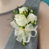 White rose boutonniere with a sheer ribbon bow