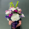 A tall, garden‑fresh bouquet that catches the eye with its purple and