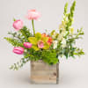 A bright spring palette of pink, white, green, and yellow announces this