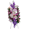 Tall standing floral spray with purple, pink, and white blooms