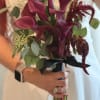 Bouquet of burgundy calla lilies with eucalyptus
