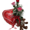 Roses in a vase with a heart balloon and teddy bear