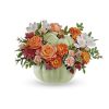 Teleflora's Whimsy Pumpkin Bouquet offers a stylish option for your autumn table.